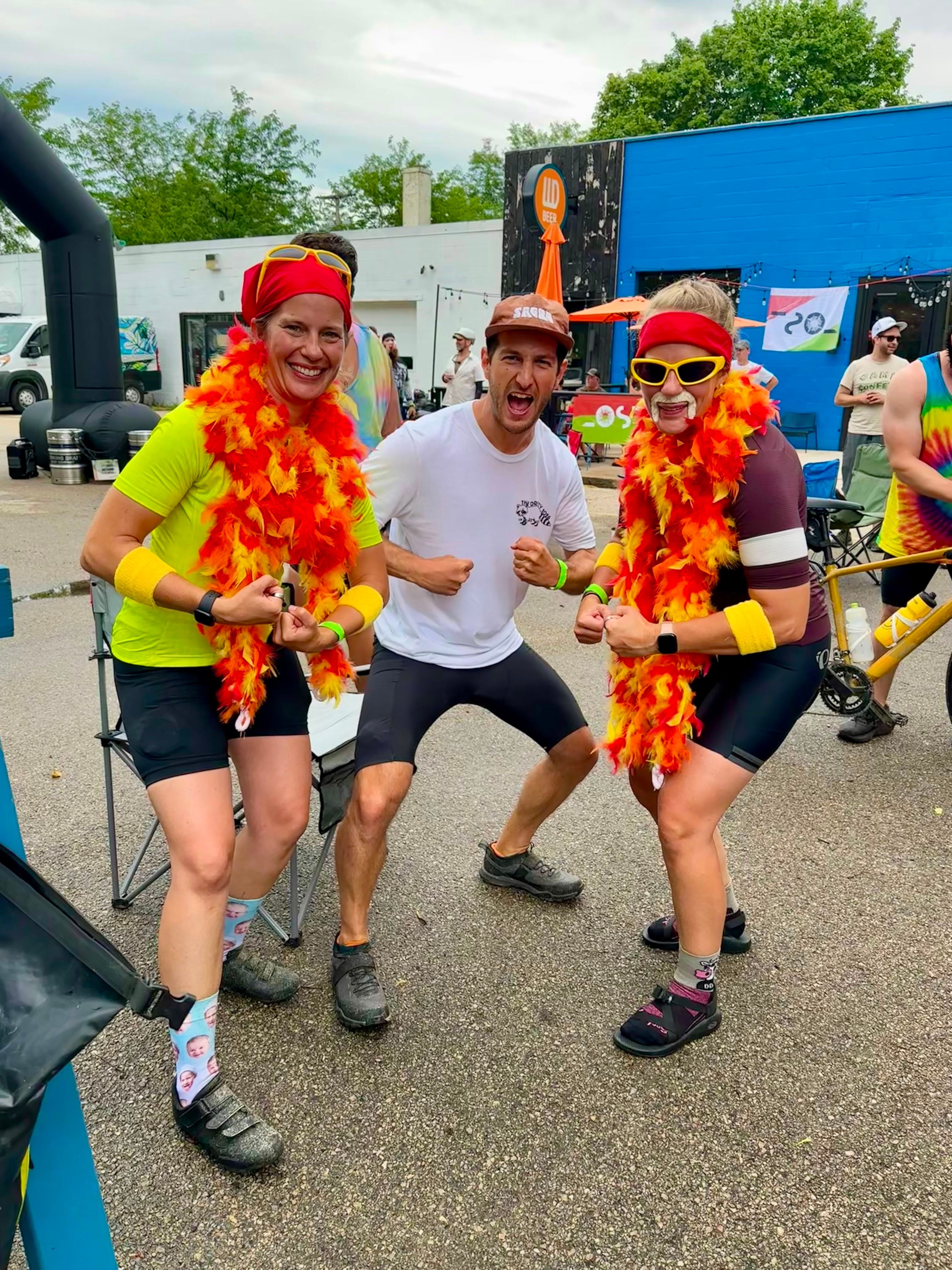 Finishers in feather boas at the brewery